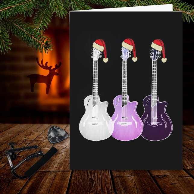 Christmas Electric Guitar pink Card (Christmas guitars wearing santa hats pink black and white music themed holiday greetings card)