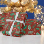 Christmas holly and pine cones pattern wrapping paper<br><div class="desc">Christmas holly with red berries and pine cones in a seamless pattern on a red background.</div>