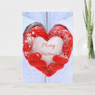 Christmas ice heart in red gloves holiday card