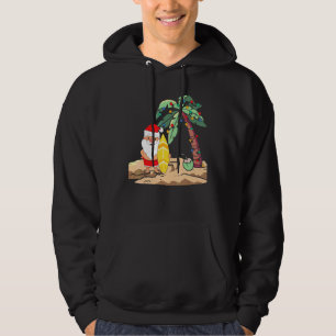 Christmas In July Santa Holding Surf Board On Trop Hoodie