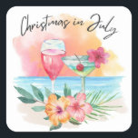 Christmas In July Tropical Beach Summer Party Square Sticker<br><div class="desc">Tropical theme Christmas in July stickers or envelope seals feature a watercolor beach sunset,  cocktails,  hibiscus flowers and palm leaves with a "Christmas in July" caption in handwritten style lettering.</div>