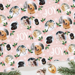 Christmas Joy Snowflake Photo Collage Pastel Pink Wrapping Paper<br><div class="desc">'Wishing you joy' fun and stylish gift wrap! An editable template, personalised with six photos of your family, friends or pets. You can also include the recipient's name, your family name or the holiday year. A seamless pattern with snowball framed photographs, festive leaves, berries, snow, snowflakes and stars. Custom gift...</div>