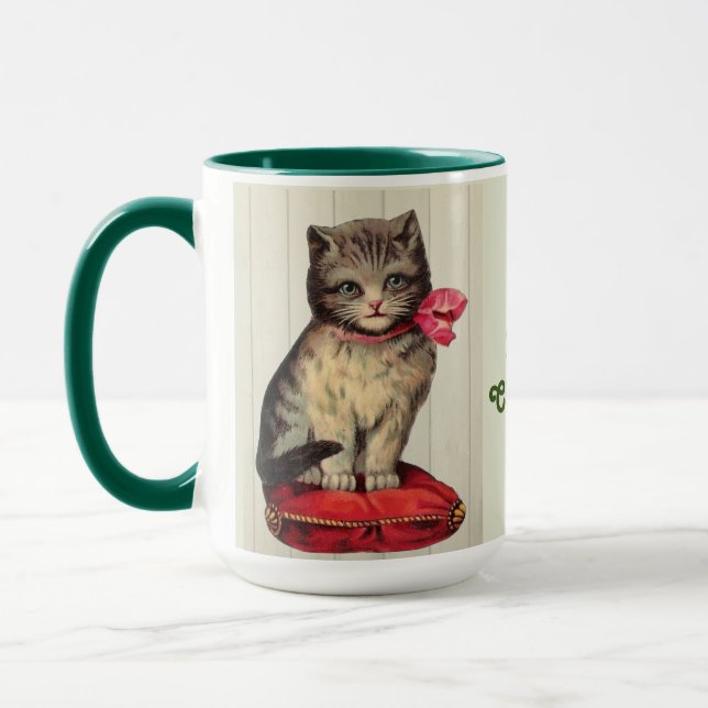 Christmas Kitten Sitting Wearing a Red Bow Mug (Left)