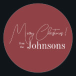 Christmas Modern Family Name Maroon Classic Round Sticker<br><div class="desc">This is a modern, Merry Christmas design. It is in trending maroon / burgundy and has the message, "Merry Christmas! from the Johnsons". Ideal for your Christmas gift wrap, mailing accessories. envelope seals, and party favour seals this festive season. To personalise, simply add your name in the personalise this text...</div>