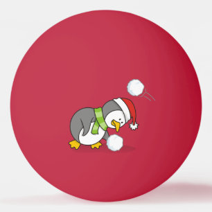 Christmas penguin getting a snow ball