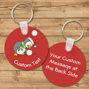 Christmas Penguin Getting a Snow Ball Keychain