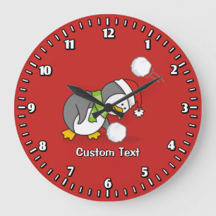 Christmas penguin getting a snow ball large clock