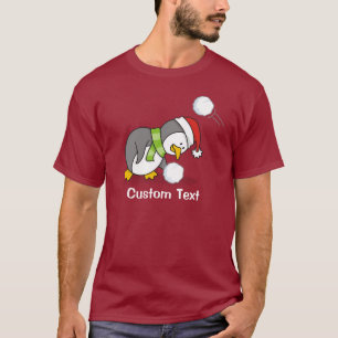 Christmas penguin getting a snow ball T-Shirt