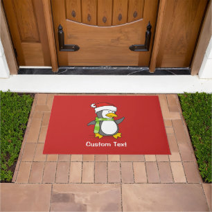 Christmas penguin walking on snow doormat