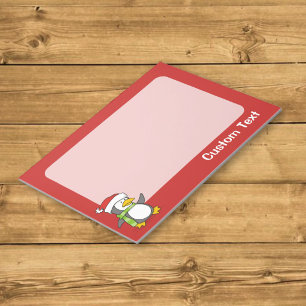 Christmas penguin walking on snow notepad