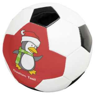 Christmas penguin walking on snow soccer ball