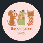 Christmas Pets Pink Classic Round Sticker<br><div class="desc">Cute and festive Christmas favour sticker featuring hand drawn illustration of cats and dogs in holiday theme. The background is pink.</div>