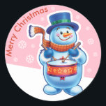 Christmas pink round sticker Snowman drummer.<br><div class="desc">Christmas pink round sticker Snowman drummer. and other Snowfolk. Winter Wonderland snowmen. Loveable wintery snowmen and snowgirl characters playing their instruments in a Christmas band. Also check out the matching loveable wintery characters with skating penguins, sledging snowgirls, skiing snowmen and skating snowmen : ) A lovely illustrated original sticker to...</div>