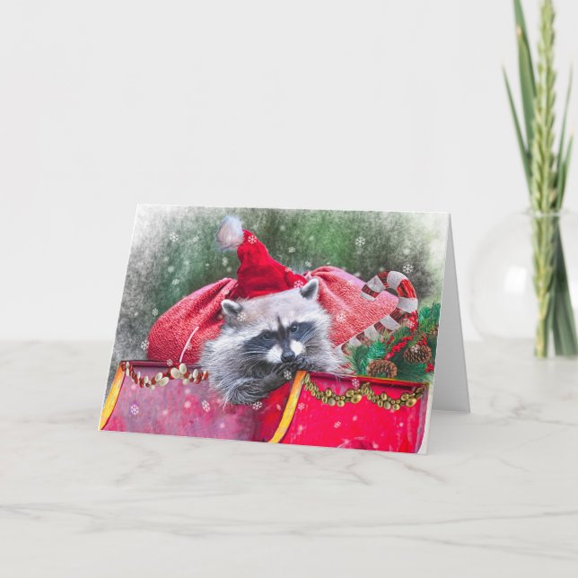 Christmas Raccoon lounging in Santa's Sleigh Holiday Card (Front)