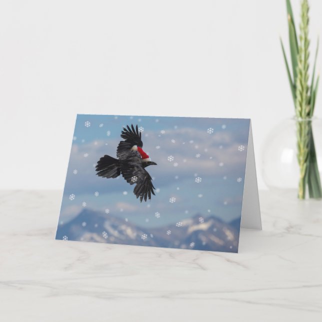Christmas raven soaring over snowy mountains card (Front)