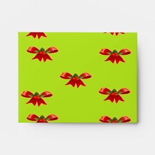Christmas red ribbon on bright green envelope