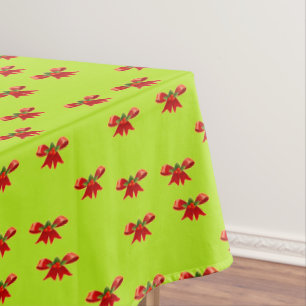 Christmas red ribbon on bright green tablecloth
