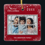 Christmas red white family photo winter window ceramic ornament<br><div class="desc">A classic dark red Christmas style background colour,  decorated with faux glitter.The text: Merry Christmas with a white hand lettered style font,  letters.  Personalise and add your own family photo and family name,  year. A winter window overlay over the photo.</div>