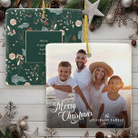 Christmas Script Photo Boho Greenery Christmas Ceramic Ornament<br><div class="desc">This simple photo Christmas ornament features "Merry Christmas" in an elegant modern script and custom text for you family name. The backside offers a boho winter greenery pattern appearing in soft tans and teals on a dark teal green background and offers extra text for first names of your family members....</div>