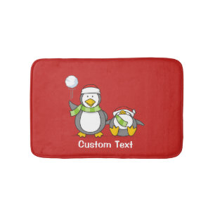 Christmas Snowballing penguins Bath Mat