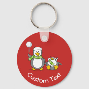 Christmas Snowballing Penguins Keychain