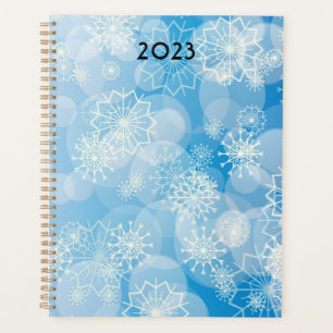 Christmas snowflakes on a blue background         planner