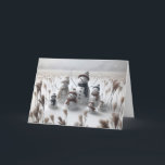 Christmas Snowman Family Holiday Card<br><div class="desc">Family of snowmen stand in a snowy field each wearing cosy hats and scarves surrounded with tall grass
All text can be changed.</div>