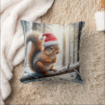 Christmas Squirrel On Snowy Tree Branch Cushion<br><div class="desc">A squirrel wearing a Santa hat is perched on a snow-covered branch in a wintry forest,  with sunlight filtering through the trees</div>