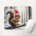 Christmas Squirrel On Snowy Tree Branch Mouse Pad<br><div class="desc">A squirrel wearing a Santa hat is perched on a snow-covered branch in a wintry forest,  with sunlight filtering through the trees</div>