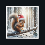 Christmas Squirrel On Snowy Tree Branch Napkin<br><div class="desc">A squirrel wearing a Santa hat is perched on a snow-covered branch in a wintry forest,  with sunlight filtering through the trees</div>