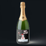 Christmas The Snowman Sparkling Wine Label<br><div class="desc">These sparkling wine labels showcase the words "Merry Christmas Ho Ho Ho" in a unique print font with multi-coloured letters and Christmas The Snowman wear red and white with snow falling in the background in this X-mas theme and style. All labels are printed with photo-quality printing great for customising weddings,...</div>