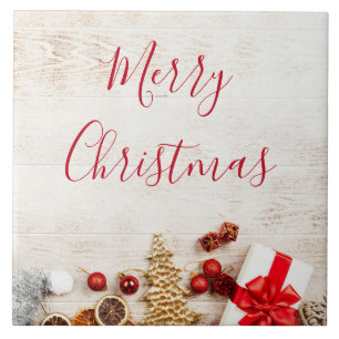 Christmas Themed Items on a Rustic Wooden Board Tile