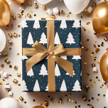 Christmas tree silhouettes white & blue wrapping paper<br><div class="desc">This Christmas wrapping paper features white pines silhouettes and little white snowflakes on an elegant and modern dark blue background.</div>