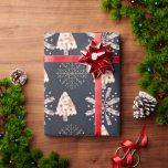 Christmas Trees and Snowflakes Black Christmas Wrapping Paper<br><div class="desc">Introducing our Modern Christmas Wrapping Paper, a stunning blend of contemporary elegance and holiday allure. This wrapping paper features a sophisticated black background adorned with a chic pattern. Majestic gold Christmas trees rise gracefully, their shimmering branches adding a touch of opulence to the design. Delicate rose gold snowflakes twirl alongside,...</div>