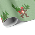 “Christmas with Bigfoot” Wrapping Paper<br><div class="desc">A sighting for the Bigfoot enthusiast on your Christmas list…the shy cryptid is out for a walk and ready to spread some holiday cheer! See a design you like but it’s not on a product you want? Email me at nharveyart@gmail.com and I will make it for you!</div>