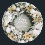 Christmas Wreath Classic Round Sticker<br><div class="desc">Round sticker features a beautiful snow-flocked pine wreath decorated with white and gold Christmas tree ornaments and flowers with a greeting and your name or company name in the middle. MATCHING items in our collection.</div>