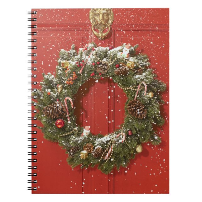 Christmas wreath hanging on a door spiral notebook (Front)