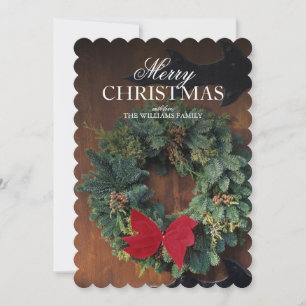 Christmas wreath on wood door holiday card