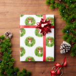 Christmas Wreath Pattern Wrapping Paper<br><div class="desc">Festive Christmas theme wrapping paper featuring watercolor illustration of a green wreath with red berries and a bow.</div>