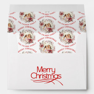 Christmas wreath with red flowers and photo envelope