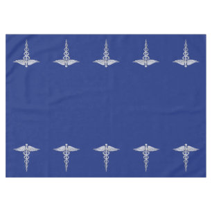 Chrome Like Caduceus Medical Symbol on Navy Blue Tablecloth