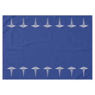 Chrome Like Caduceus Medical Symbol on Navy Blue Tablecloth