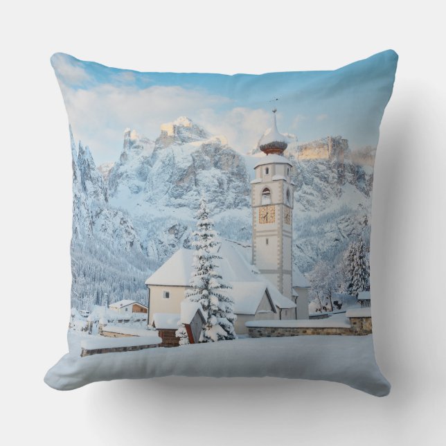 Church covered in snow with mountain background cushion (Front)