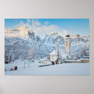 Church covered in snow with mountain background poster
