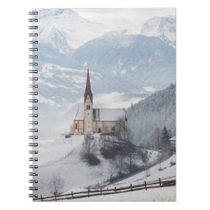 Church in an alpine winter landscape notebook