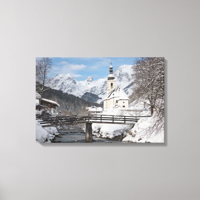 Church in the snow with Alps mountains in winter Canvas Print (Front)