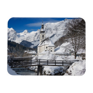 Church in the snow with Alps mountains Magnet