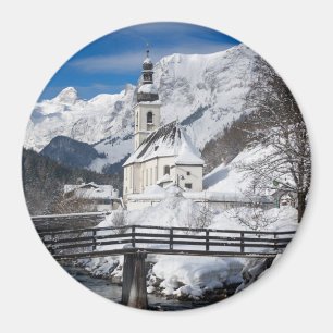Church in the snow with Alps mountains Magnet