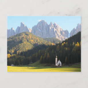 Church with Dolomites mountain background postcard