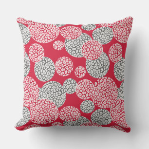 Circles with grey and red leopard skin print on a cushion